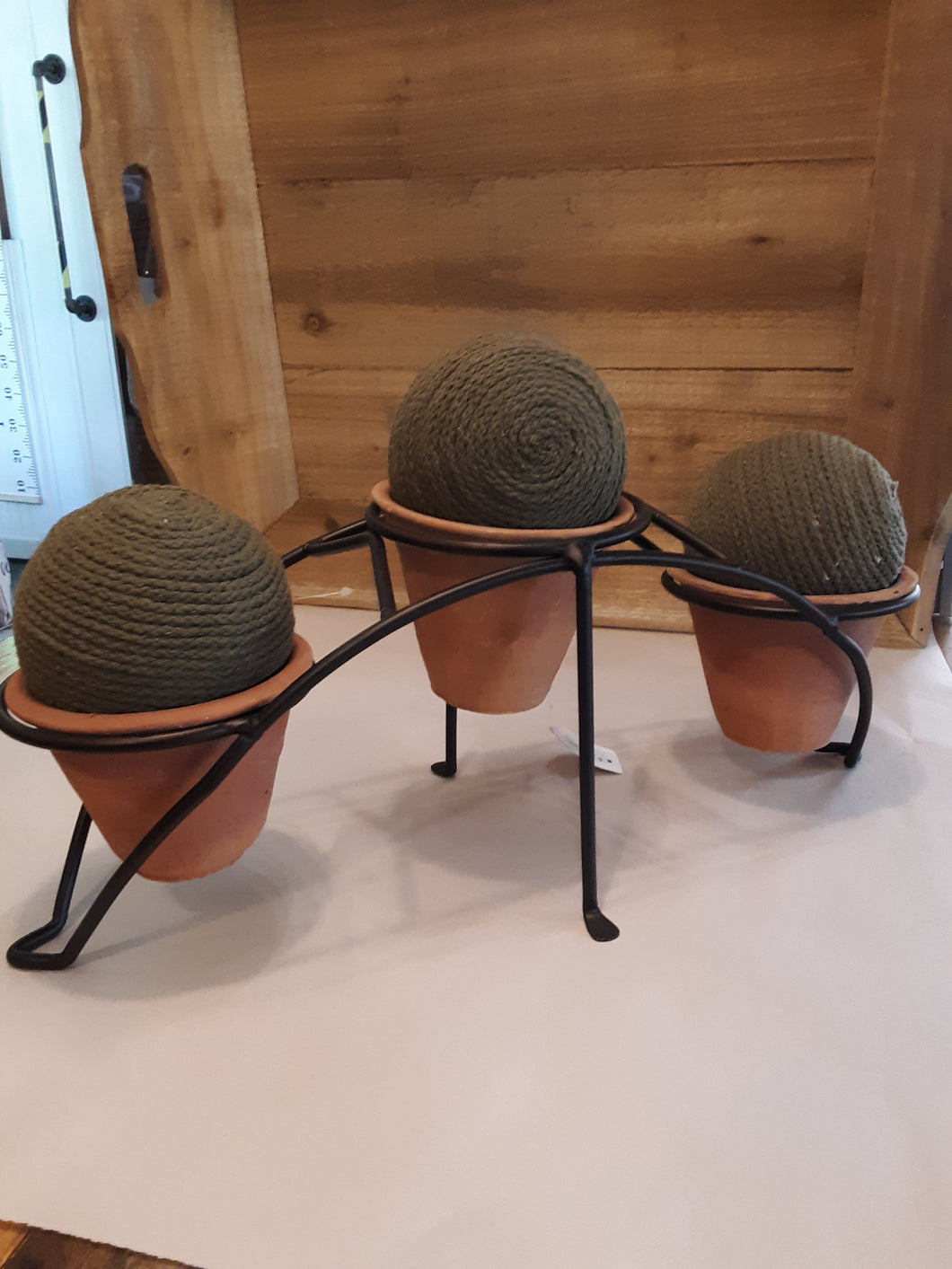 metal rack with 3 pots