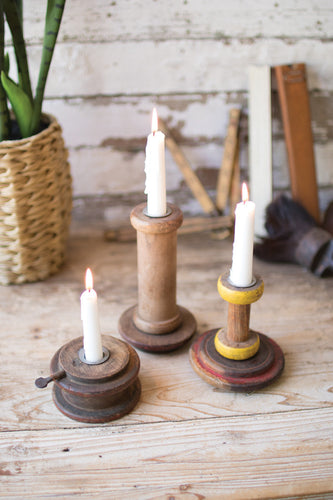 repurposed wooden spool taper candle holders