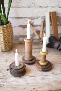 repurposed wooden spool taper candle holders